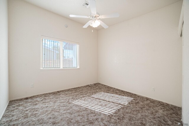 13779 E 54th Dr, Yuma, AZ 85367 - spare room with visible vents, carpet flooring, and a ceiling fan
