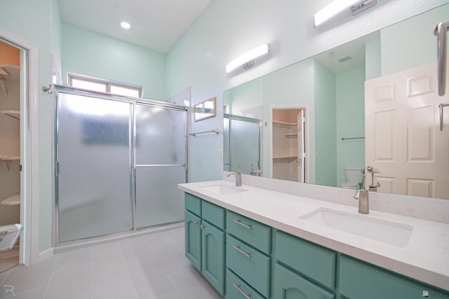 13779 E 54th Dr, Yuma, AZ 85367 - bathroom with a sink, tile patterned flooring, a stall shower, and toilet