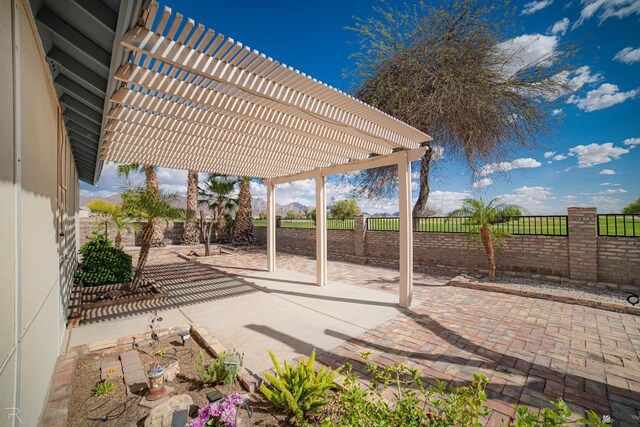 13779 E 54th Dr, Yuma, AZ 85367 - view of patio with a fenced backyard and a pergola