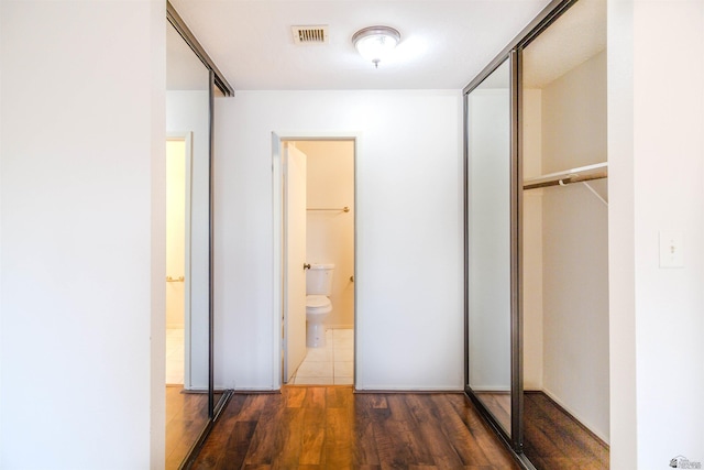 12402 E Via Estrella, Yuma, AZ 85367 - unfurnished bedroom featuring wood finished floors, a closet, and ensuite bathroom