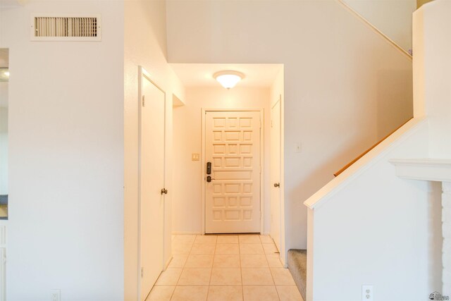 12402 E Via Estrella, Yuma, AZ 85367 - hall featuring light tile patterned flooring and stairs
