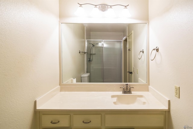 12402 E Via Estrella, Yuma, AZ 85367 - bathroom featuring vanity, a shower stall, and toilet