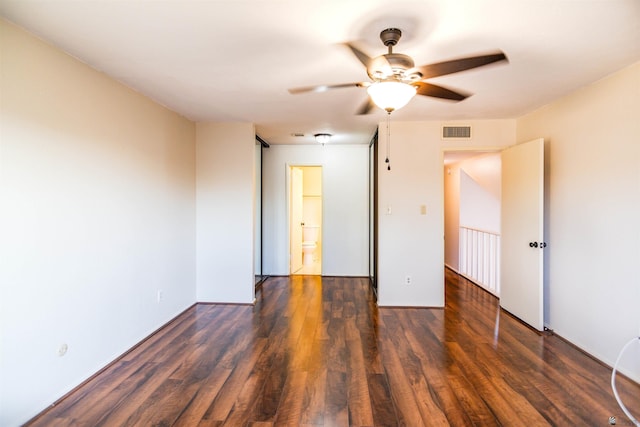 12402 E Via Estrella, Yuma, AZ 85367 - unfurnished bedroom featuring wood finished floors, a ceiling fan, and connected bathroom