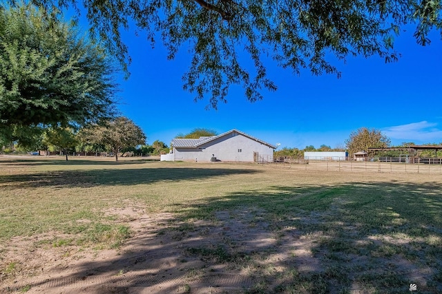 view of yard with a rural view