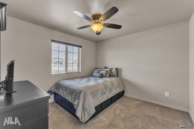 bedroom featuring a ceiling fan, light colored carpet, and baseboards