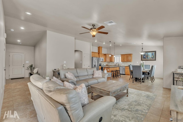 living area with recessed lighting, visible vents, ceiling fan, and light tile patterned flooring