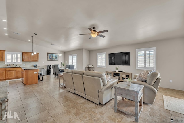 living area featuring visible vents, lofted ceiling, light tile patterned flooring, recessed lighting, and ceiling fan