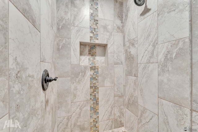 details featuring a tile shower