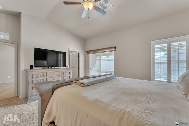 bedroom featuring visible vents, light carpet, lofted ceiling, and a ceiling fan