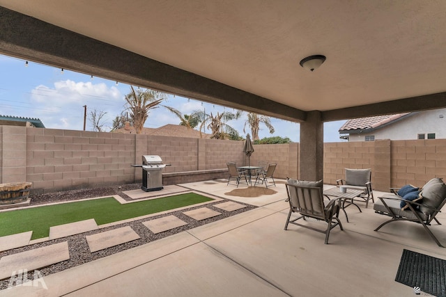 view of patio / terrace with a grill and a fenced backyard