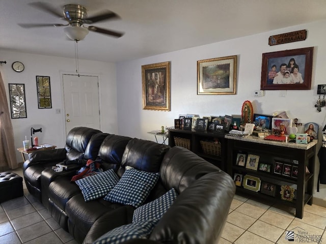 living room featuring ceiling fan and light tile patterned floors