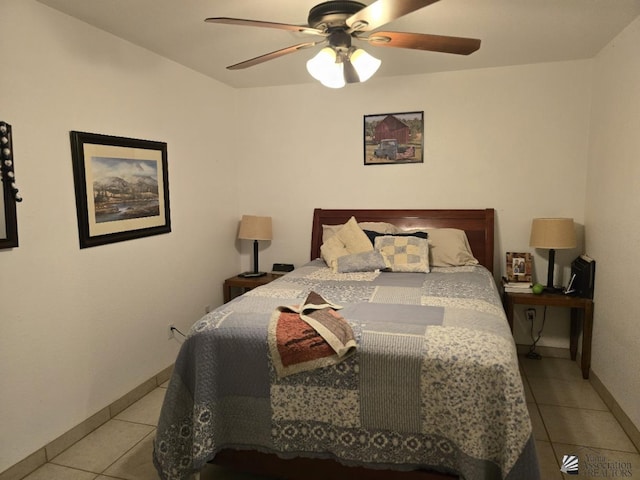 bedroom with ceiling fan and light tile patterned floors