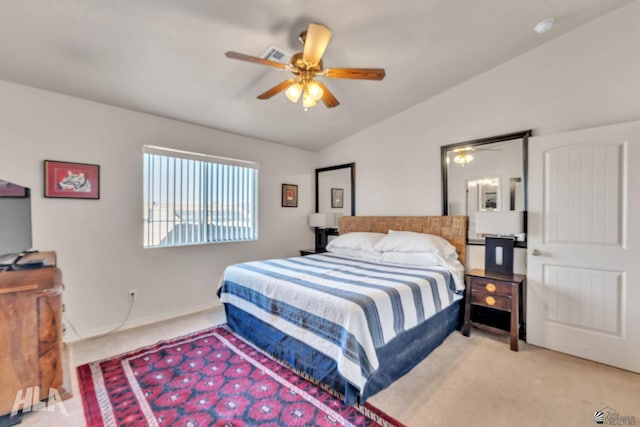 bedroom featuring lofted ceiling, light carpet, and ceiling fan