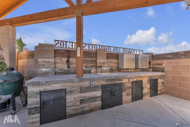 view of patio / terrace featuring grilling area and sink