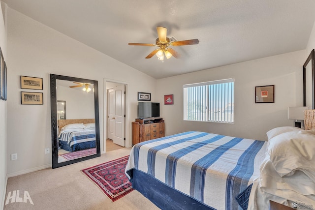 bedroom featuring ceiling fan, light colored carpet, and lofted ceiling