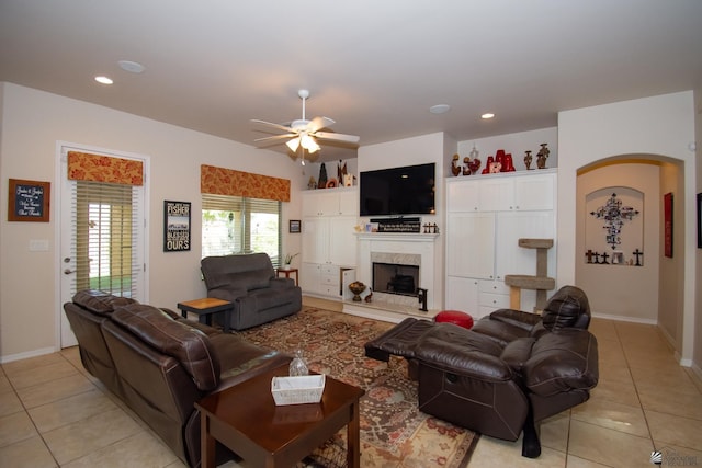 tiled living room featuring ceiling fan