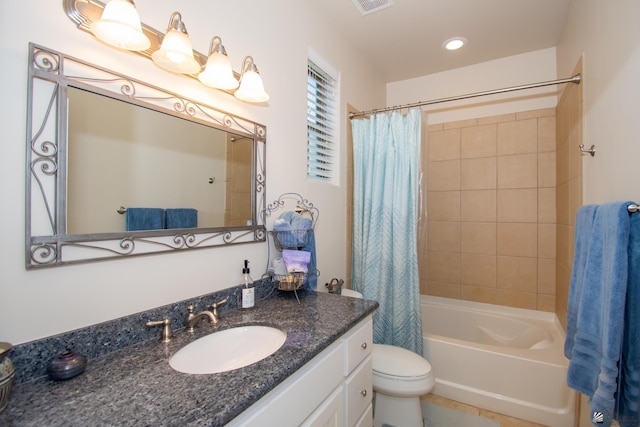 full bathroom featuring vanity, shower / bathtub combination with curtain, and toilet