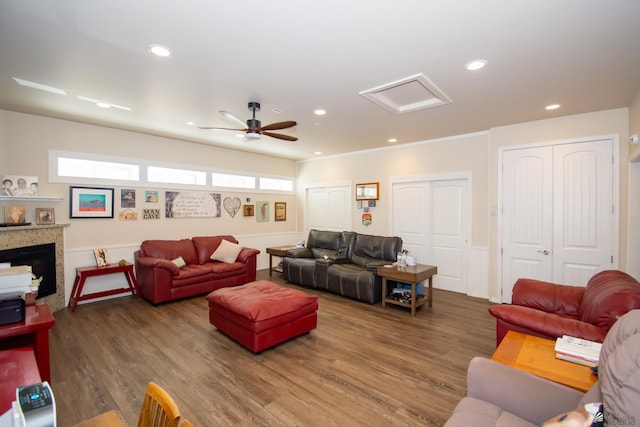 living room featuring hardwood / wood-style floors and ceiling fan