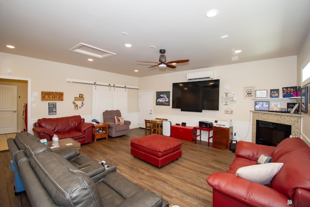 living room featuring ceiling fan and wood-type flooring