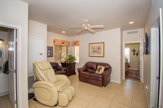 tiled living room featuring ceiling fan