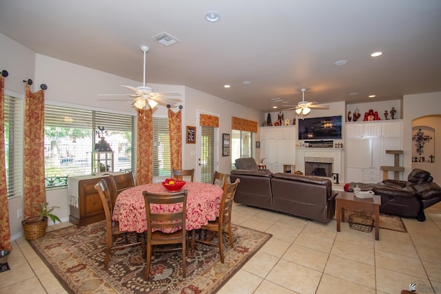 dining area with ceiling fan and light tile patterned floors