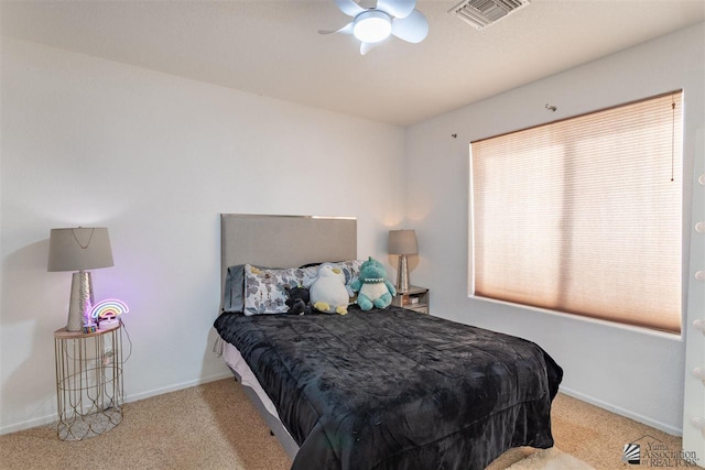 bedroom featuring light colored carpet