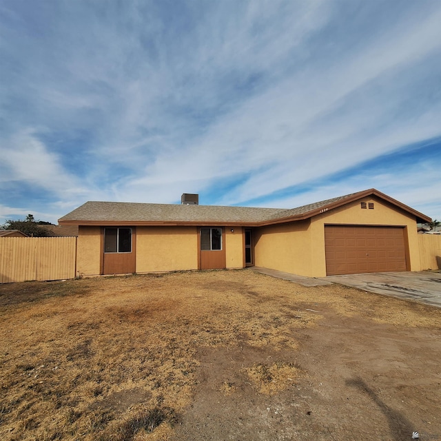 ranch-style house featuring a garage