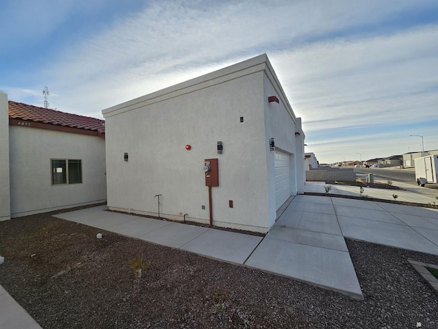 view of property exterior with a garage