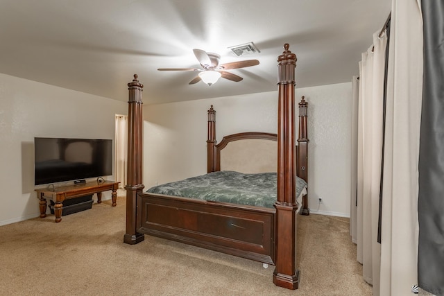 bedroom featuring light carpet and ceiling fan