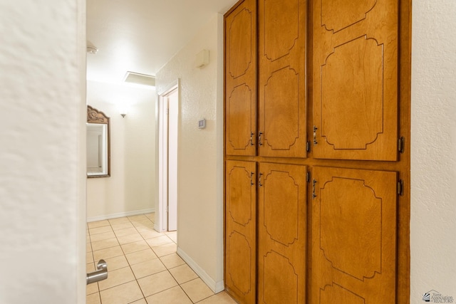 hallway featuring light tile patterned floors