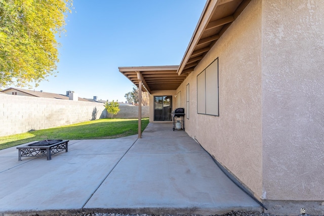 view of patio featuring a grill