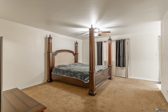 bedroom featuring light carpet and ceiling fan