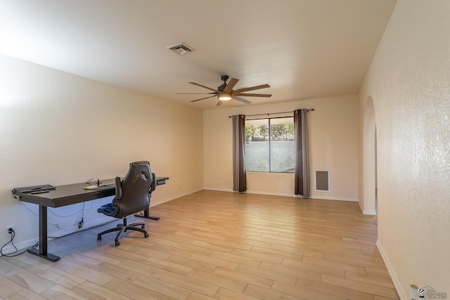 office space featuring ceiling fan and light wood-type flooring