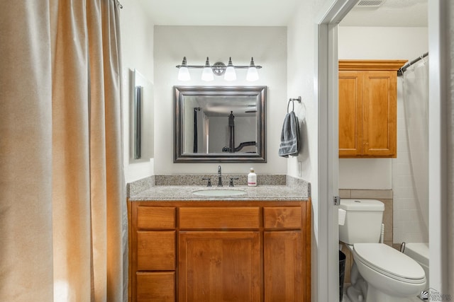 bathroom with vanity and toilet