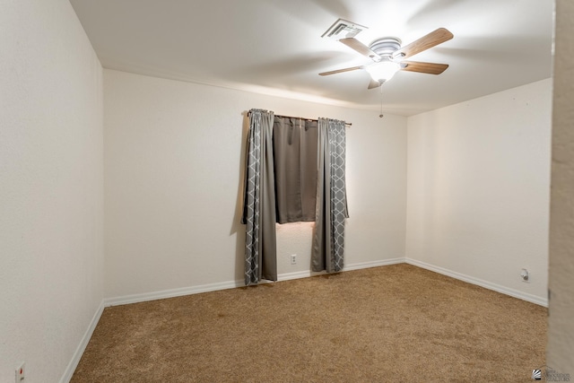 empty room with ceiling fan and carpet flooring