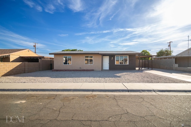 ranch-style house with a carport