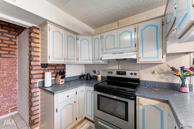 kitchen with brick wall, stainless steel electric range, a textured ceiling, and light tile patterned floors