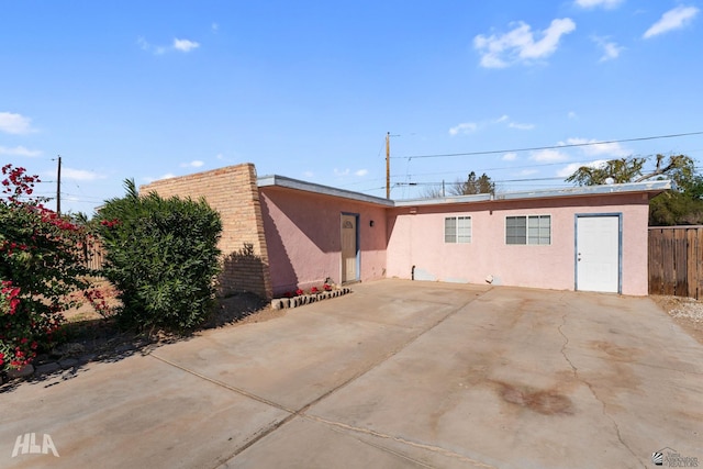 rear view of property featuring a patio area