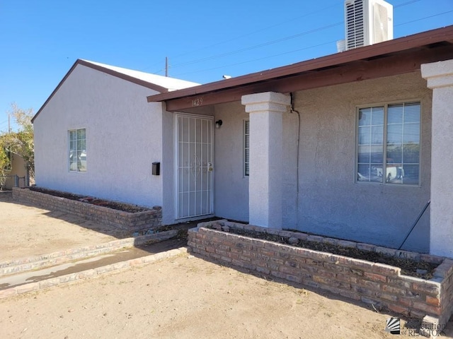 property entrance featuring central AC