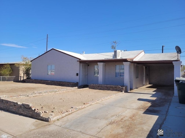 view of front facade with a carport