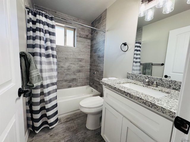 full bath with shower / bath combo with shower curtain, toilet, wood finished floors, and vanity