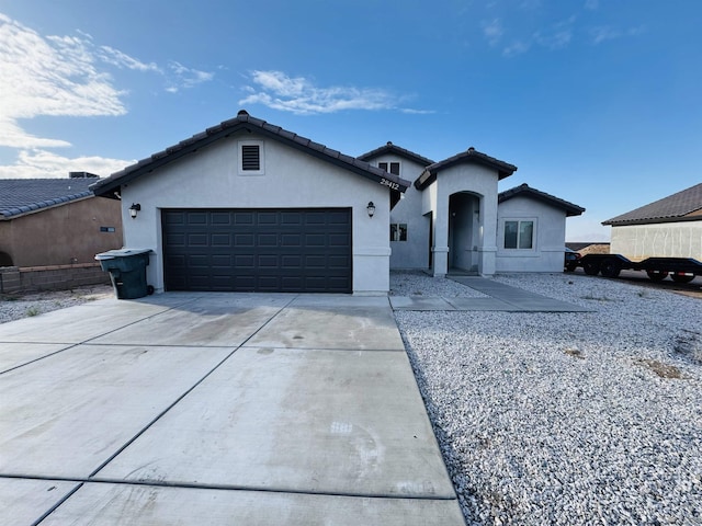 single story home featuring stucco siding, an attached garage, driveway, and a tile roof