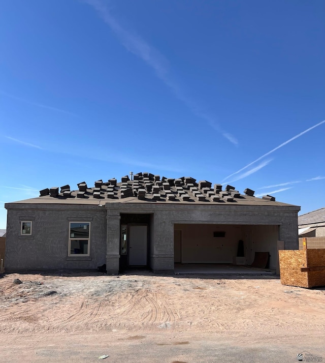 property in mid-construction with a garage