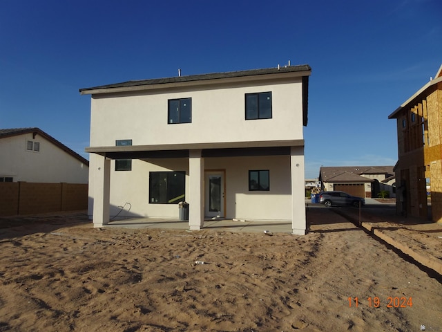 back of house with a patio