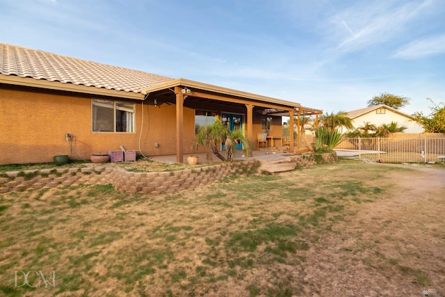 rear view of property featuring a patio