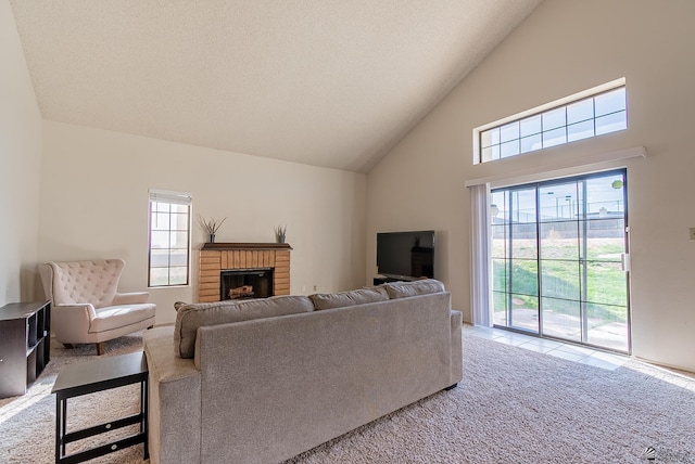 living area with light colored carpet, a brick fireplace, high vaulted ceiling, and a textured ceiling