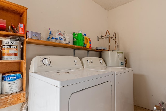 laundry area featuring laundry area, separate washer and dryer, and electric water heater