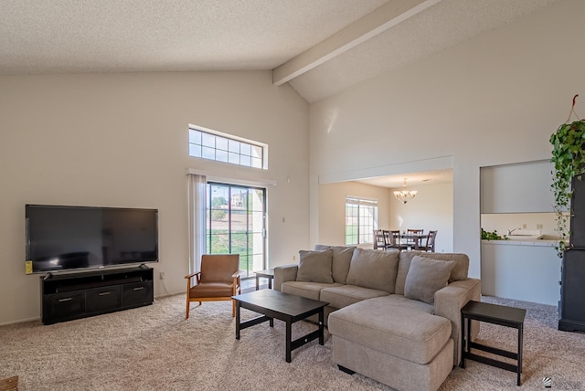 living room with light colored carpet, beam ceiling, an inviting chandelier, a textured ceiling, and high vaulted ceiling