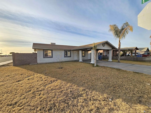 ranch-style house with a lawn