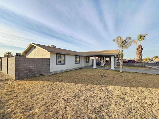 view of front of property with a patio area and a front yard